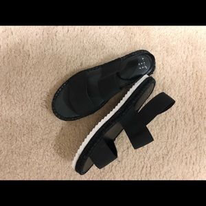 Black low flat form shoes